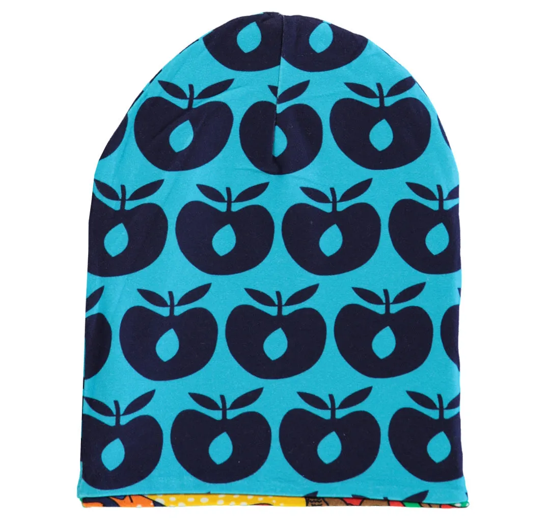 Reversible beanie with apples and dinosaurs